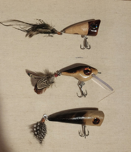 Lures with feathered treble hooks.